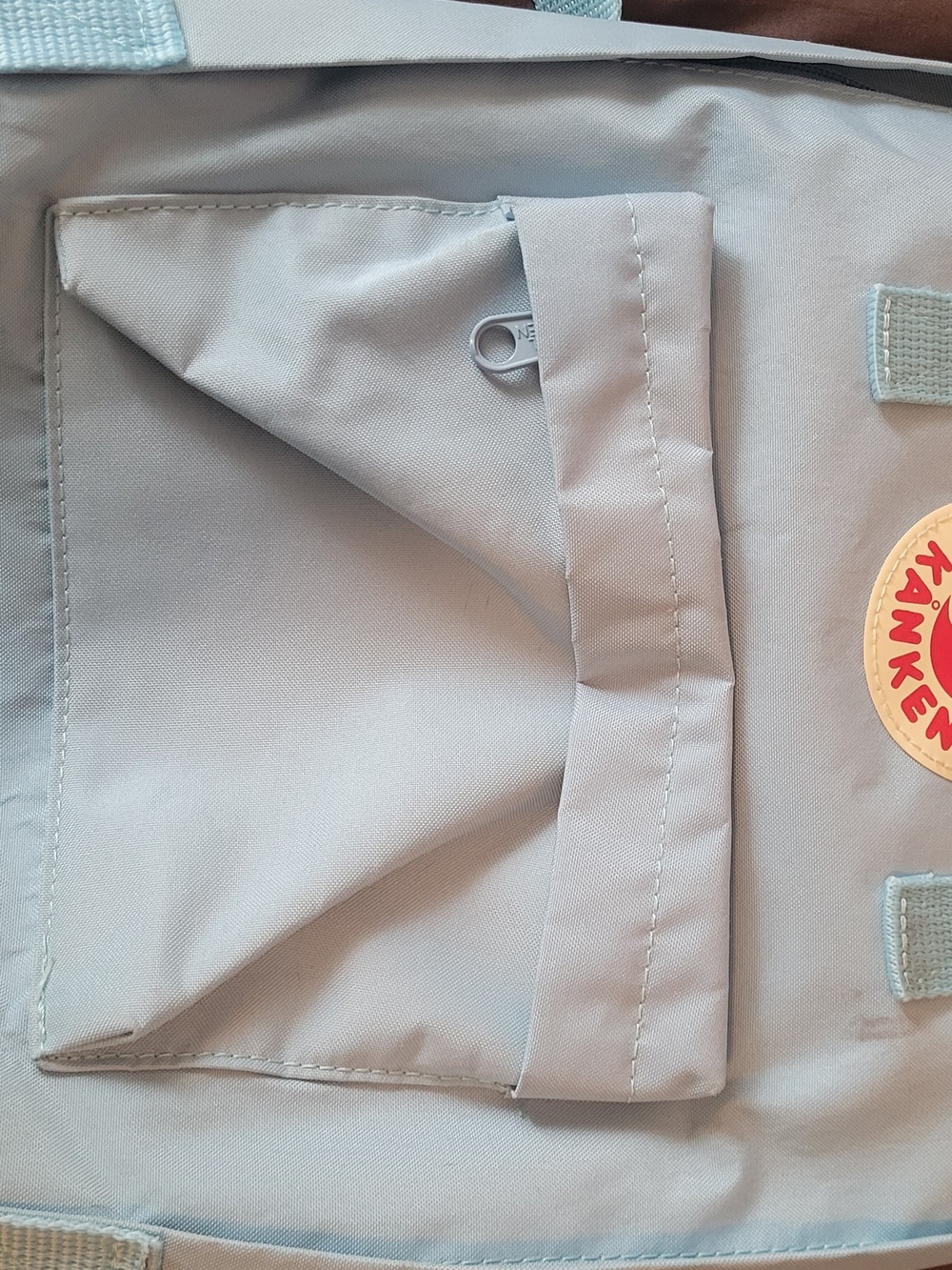 Fjallraven Kånken Backpack in Light Gray with Red Logo